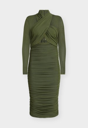 Abito verde oliva a maniche lunghe con scollo incrociato, tessuto arricciato e silhouette aderente. Presenta una chiusura con cerniera sul retro.