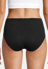 Schwarze Baumwoll-Hipster-Unterwäsche mit glatter Textur, elastischem Bund und einem schlichten, nahtlosen Design. Hat einen mittleren Be cuts.