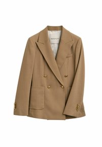 Blazer doppiopetto in tessuto marrone chiaro. Presenta bottoni dorati, rever a punta e due tasche frontali. Interno foderato.