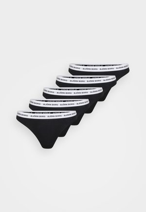 Mustat puuvillaiset stringit, joissa on leveä valkoinen vyötärönauha, jossa on mustalla tekstillä "BJÖRN BORG". Viisi paria esillä rivissä.