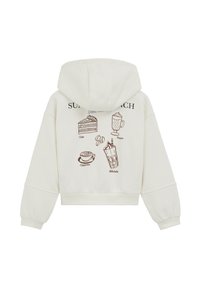 Felpa cropped color crema con cappuccio, caratterizzata da illustrazioni a tema caffè marroni sul retro, che includono torta, bevande e chicchi di caffè.