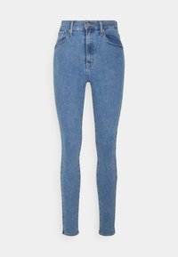 Jeans skinny de mezclilla azul con cintura alta, con dos bolsillos frontales y un solo botón de cierre en la cintura. Textura suave.