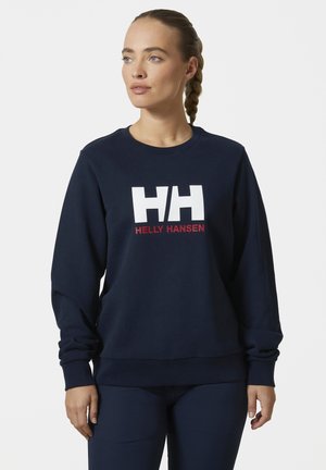 Granatowa bluza z gładkiego materiału, z dużym białym logotypem "HH" oraz napisem "HELLY HANSEN" w kolorze czerwonym, z ściągaczami przy rękawach i u dołu.