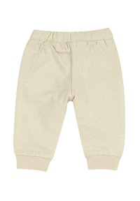 Pantalon jogger en coton beige clair avec taille élastique et poignets côtelés. Texture lisse et coupe fuselée, idéal pour un usage décontracté.