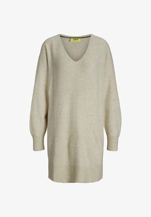 Beżowy oversize sweter z głębokim dekoltem w kształcie litery V, prążkowanymi mankietami i dołem. Wykonany z miękkiego, teksturowanego materiału. Posiada subtelny wzór.