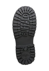 Suela de zapato de goma negra con patrones de ondulación profundos, superficie texturizada y un logotipo circular en el centro, marcado con la talla 36.