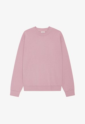 Ροζ φούτερ κατασκευασμένο από μαλακό ύφασμα, με στρογγυλή λαιμόκοψη, μακριά μανίκια, ριμπ μανσέτες και άνετη εφαρμογή. Χωρίς σχέδια ή γραφικά.