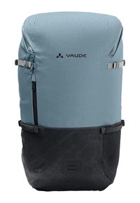 Zaino in tessuto ripstop azzurro chiaro con sezione inferiore nera, dotato di tasca con zip, logo e spallacci regolabili.