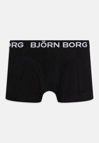 Crni pamučni bokserice s bijelim pojasom označenim "BJÖRN BORG", s ravnim šavovima i dizajnom koji se čvrsto prilagođava.