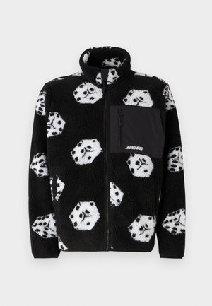 Černá fleecová bunda na zip s bílým vzorem kostek, vysokým límcem a přední kapsou na zip v jednobarevné černé tkanině. Měkká textura.
