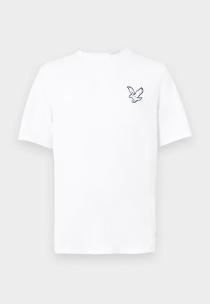 T-shirt blanc à manches courtes avec un petit graphique d'une colombe en vol sur le haut gauche de la poitrine.