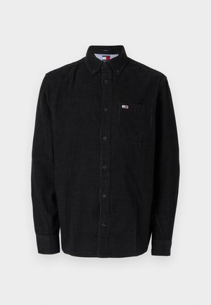 Zwarte button-up overhemd in een gestructureerde stof. Beschikt over een enkele zak en een klein logo, met lange mouwen en een kraag.