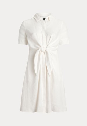 White linen short-sleeve dress with a collar and a knotted front detail. Features a relaxed fit and a slightly flared skirt.