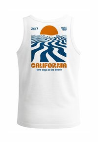 White tank top featuring a graphic design with blue ocean waves and an orange sun. Text includes "CALIFORNIA" and "slow days at the beach."