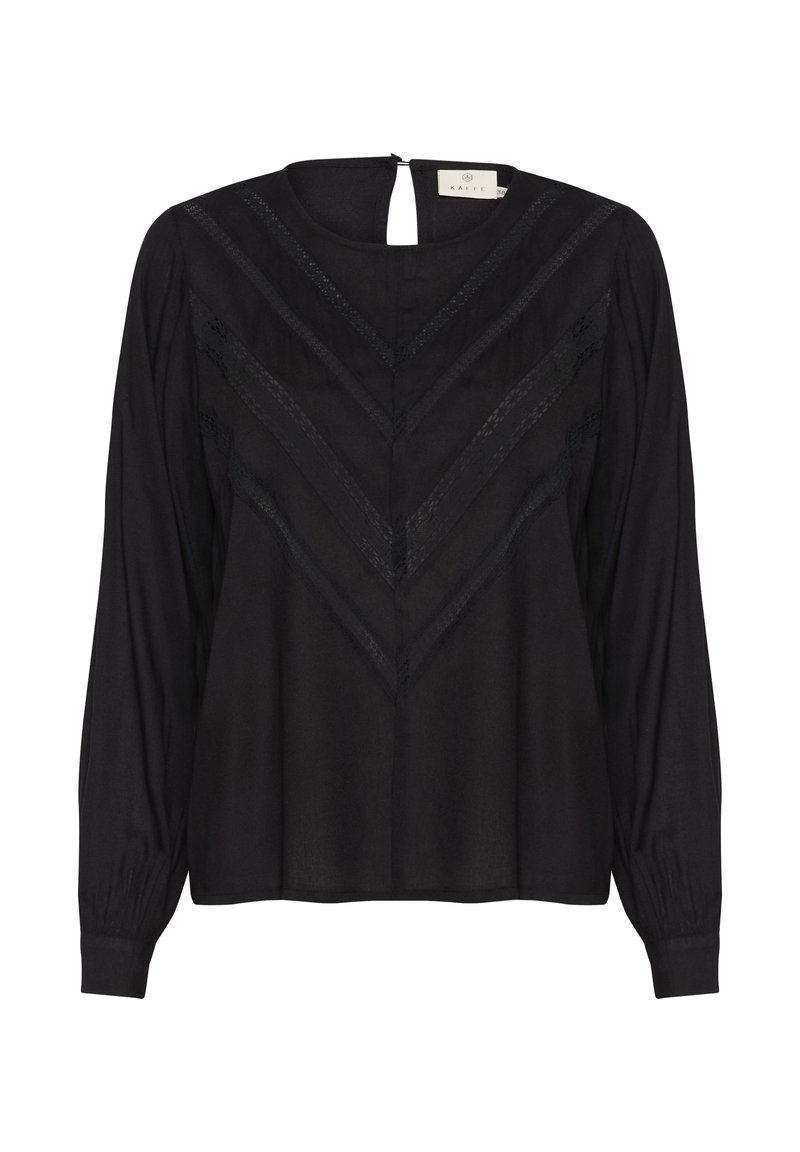 Blouse noire à manches longues avec des rayures en dentelle en forme de V à l’avant, col rond, fermeture boutonnée dans le dos et poignets froncés.