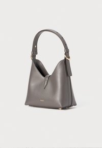 Gray leather handbag with a unique triangular shape, short handle, and gold hardware accents. Features a simple design and brand logo.