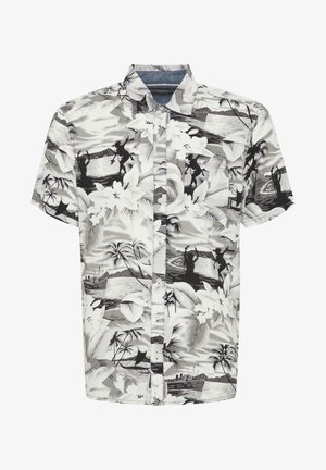 Short-sleeve button-up shirt in black and white featuring a tropical floral and landscape pattern with silhouettes and a chest pocket.