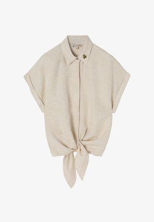 Vaaleanbeige lyhythihainen paita, jossa on kaulus, solmittu etuosa ja hienovarainen kukkakirjailu. Valmistettu kevyestä kankaasta.