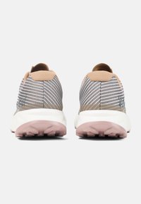 Trail running shoes with a breathable gray mesh upper and beige accents, featuring a white midsole and pink, textured rubber outsole.