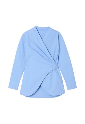 Világoskék, hosszú ujjú, batikolt ing, sima anyagból készült, amely egyedi ívelt szegéllyel és V nyakú mintával rendelkezik.