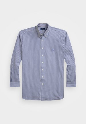 Stripet langermet skjorte i marineblått og hvitt, med krage med knapper, standard mansjetter og en liten logo på brystet. Materiale i bomullsblanding.