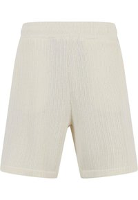 Ribbede shorts i en kremhvit farge, med elastisk midje og et mykt, teksturert stoff. Skreddersydd passform med rette benåpninger.
