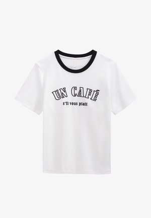 White T-shirt with black ribbed crew neck, featuring printed text in black that reads "UN CAFÉ s'il vous plait." Short sleeves, soft fabric.