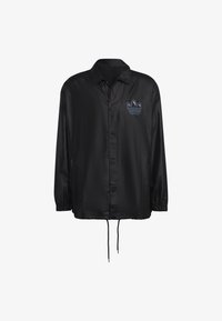 Veste noire légère avec un devant à boutons, un ourlet à cordon de serrage et des poignets élastiques. Présente un logo bleu brodé sur la poitrine.