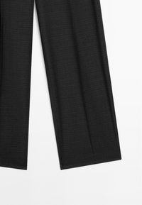 Dark gray tailored dress pants with subtle checkered pattern, shown from waist to hem on a white background.