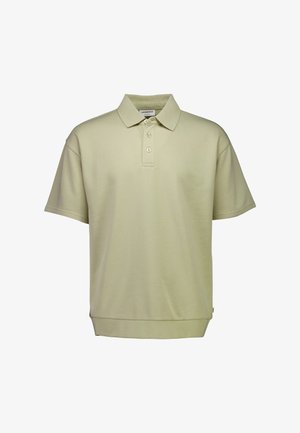 Poloshirt in lichtbeige, korte mouwen, gemaakt van zachte katoen. Voorzien van een klassieke kraag, drie knopen en een omzoomde onderkant. Zonder patronen.