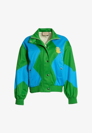 Grüne und blaue, farbblockierte Gucci-Jacke mit Druckknöpfen, elastischen Bündchen und Saum sowie einem kleinen, gestickten gelben Tiergesicht auf der Brust.