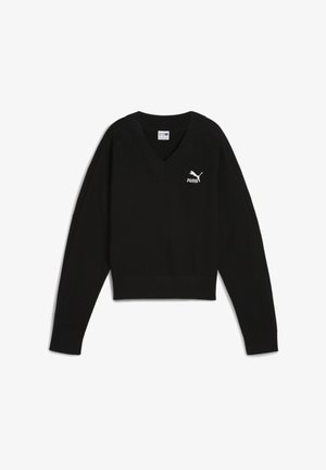 Crni pleteni pulover s V-izrezom, koji ima rebrasti rub i dugi rukavi. Bijeli Puma logo na lijevoj strani prsnog koša. Teksturalni riblji kost obrazac.