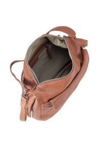 Brown leather bag with a zip closure, featuring a soft, textured exterior, spacious interior, and a zippered pocket for organization.