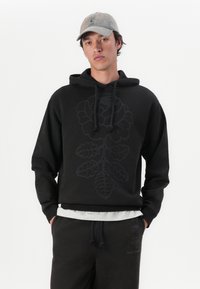 Marimekko SANOMA VIHKIRUUSU PLACEMENT UNISEX - Sportska majica - dark brown/grey