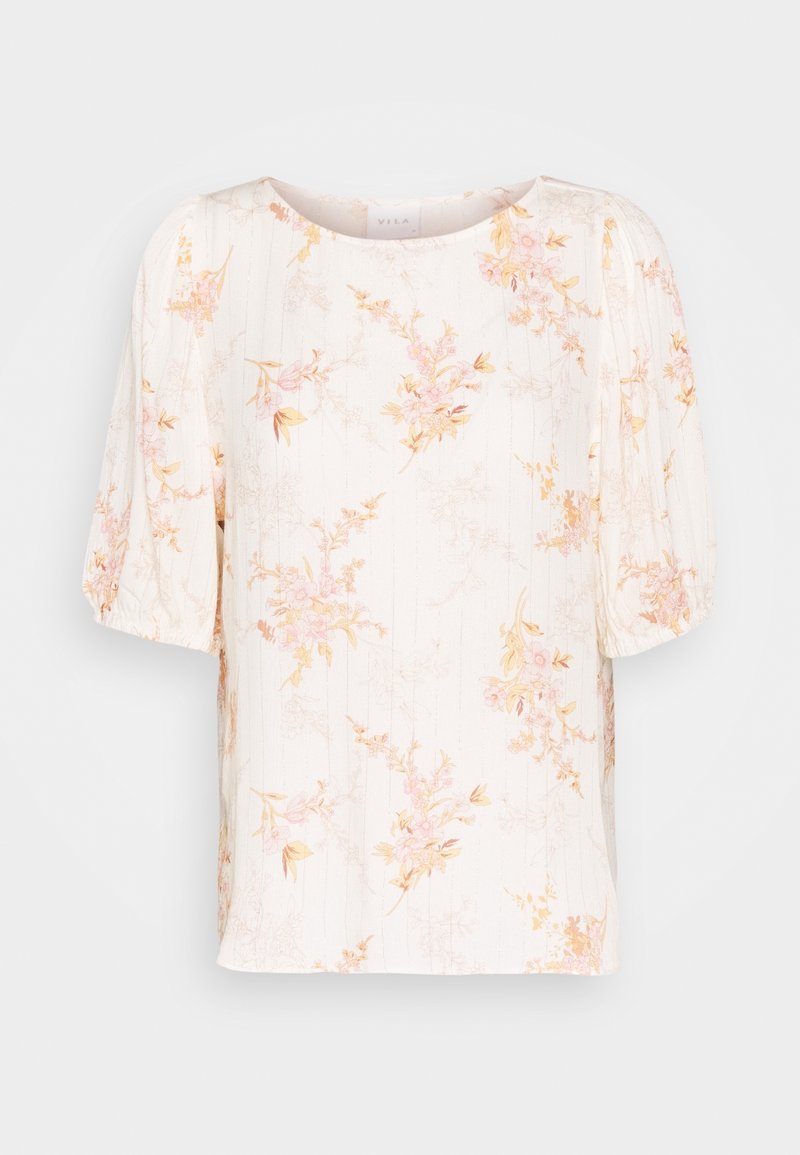 Blouse imprimée à fleurs en crème avec des accents rose et jaune. Présente un col rond, des manches courtes bouffantes et des rayures verticales texturées.