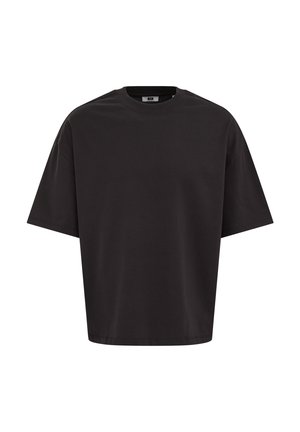 T-shirt noir uni oversize à manches courtes avec col rond, présenté de face sur un fond blanc.