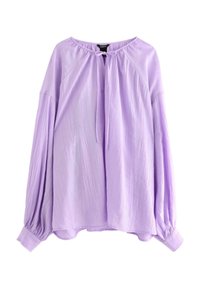 Blusa lunga a manica con colletto rotondo in lavanda chiaro, dettagli con fiocco, maniche arricciate e tessuto testurizzato. Vestibilità rilassata con orlo curvo.