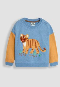 Kék pamut pulóver barna ujjakkal, hímzett tigris mintával, zöld növényekkel, és az "grrr" felirattal az elején.