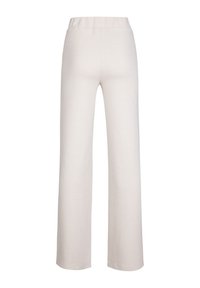 Wijde pijpen in lichtbeige met een gestructureerd herringbone patroon. Voorzien van een elastische tailleband en een soepele afwerking.