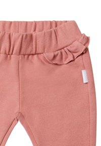 Roze leggings gemaakt van zachte stof, met een elastische tailleband met gerimpelde accenten, een gladde textuur en een klein merklabel aan de zijkant.