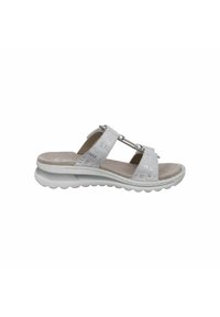 White slip-on sandals with textured straps, decorative hardware, and a cushioned sole. Features a light, flexible design suitable for casual wear.