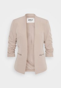 Béžový blazer so strmam strihom, naťahovacími rukávmi a dvoma bočnými zipsovými vreckami. Vyrobený z hladkej tkaniny s minimalistickým dizajnom.
