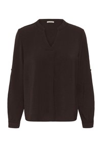 Tumepruun, pika varrukaga pluus V-kaelusega, valmistatud tekstureeritud kangast. Omab kogutud mansette ja väikest lõhet kaeluse juures.