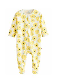Kollane lillemustriga beebi kombinesoon pehmest kangast, esiküljel lukuga, pikkade varrukatega ja jalgade kattega soojuse tagamiseks.