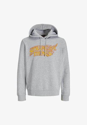 Pelēks kapuce, kas izgatavota no kokvilnas maisījuma, ar priekšējo grafiku "Dīvainas lietas" dzeltenā un oranžā liesmu dizainā. Regulējama kapuce un ribotas aproces.