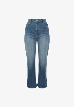High-waisted blue denim jeans with a flared shape, featuring stud detailing along the side seams and a smooth texture.