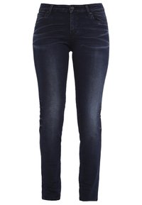 Mörkblå denimjeans med slim fit, fem fickor, knapplås och subtila sömdetaljer längs sömmarna.