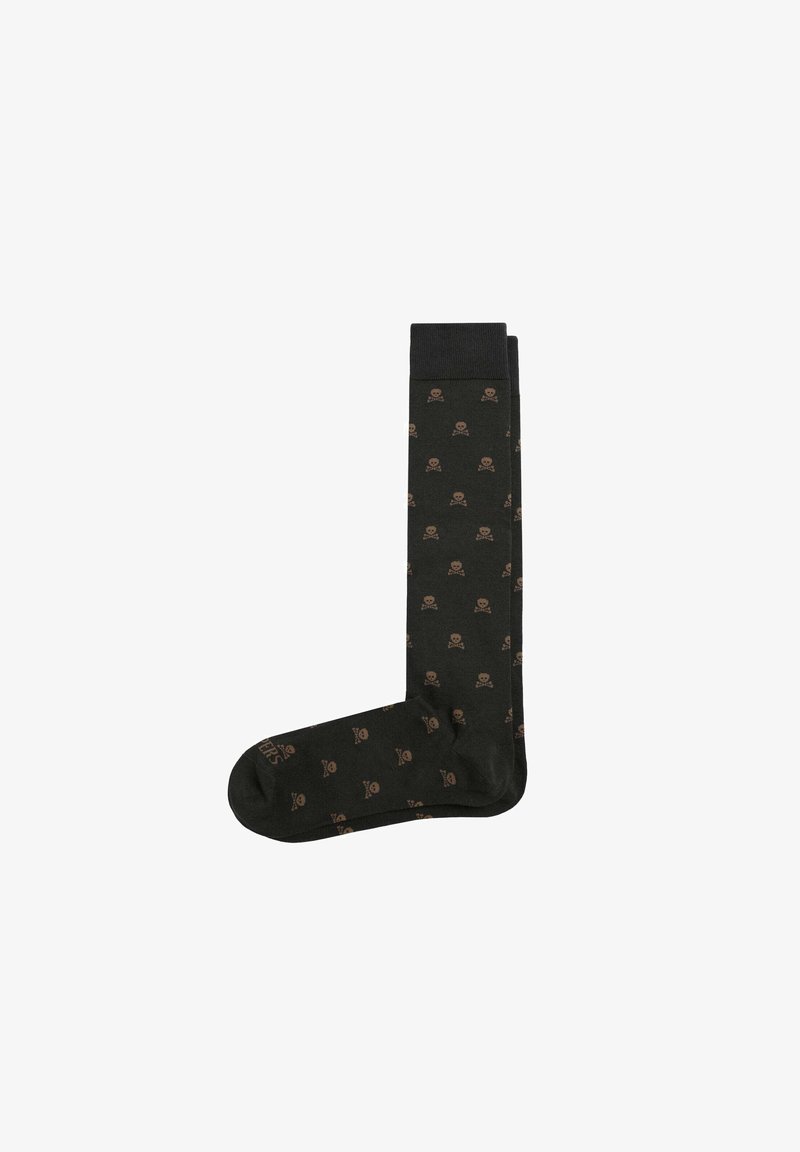 Chaussettes montantes noires avec un motif de crânes et de tibias en marron. Fabriquées en matériau doux et extensible.