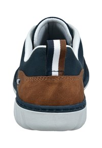 Navy and brown sneaker with a soft textile upper, white lining, and a stripy pull tab at the back. Features a rubber sole.