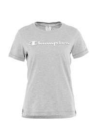Camiseta de algodón gris con mangas cortas y cuello redondo, que presenta un gran logo blanco de "Champion" en el pecho y un pequeño logo en la manga.